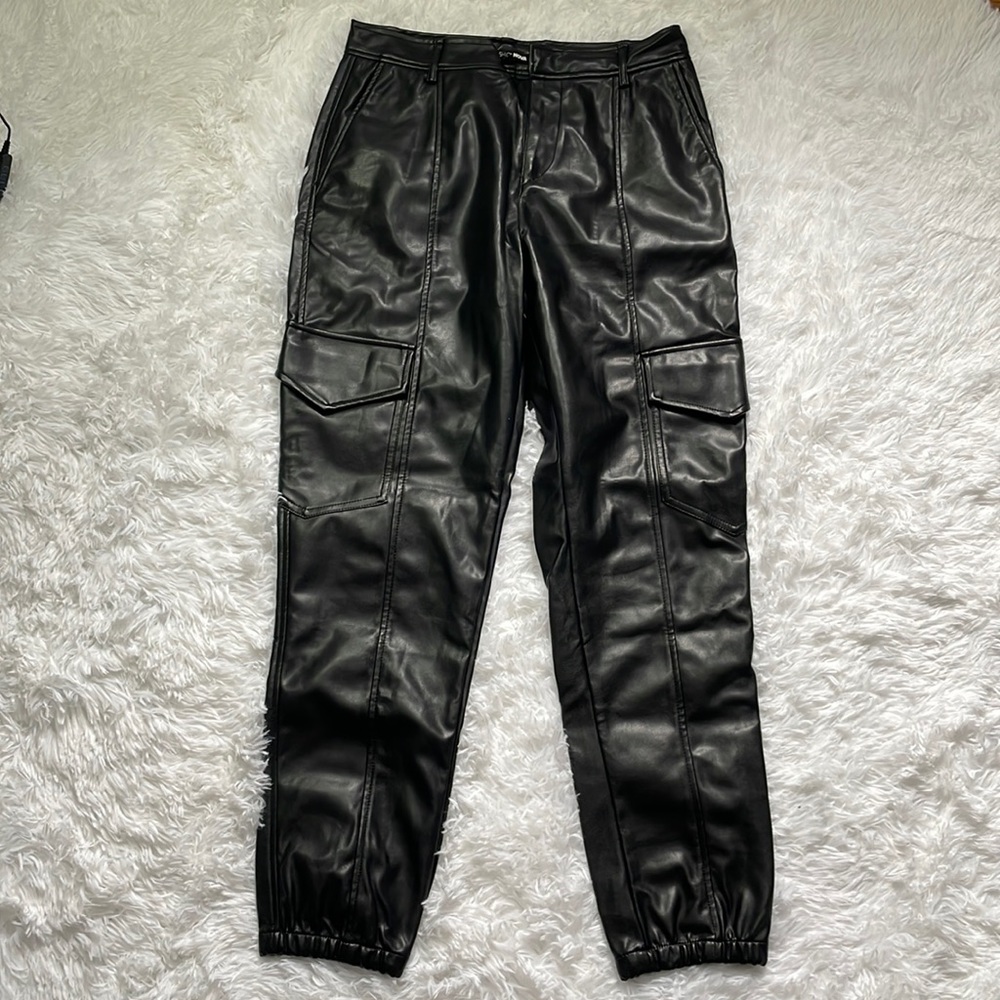 Black faux leather pants. Size M.